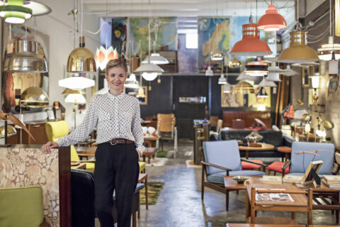 Portrait of a female business owner standing in her furniture store