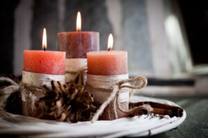 Orange candles with birch decorations